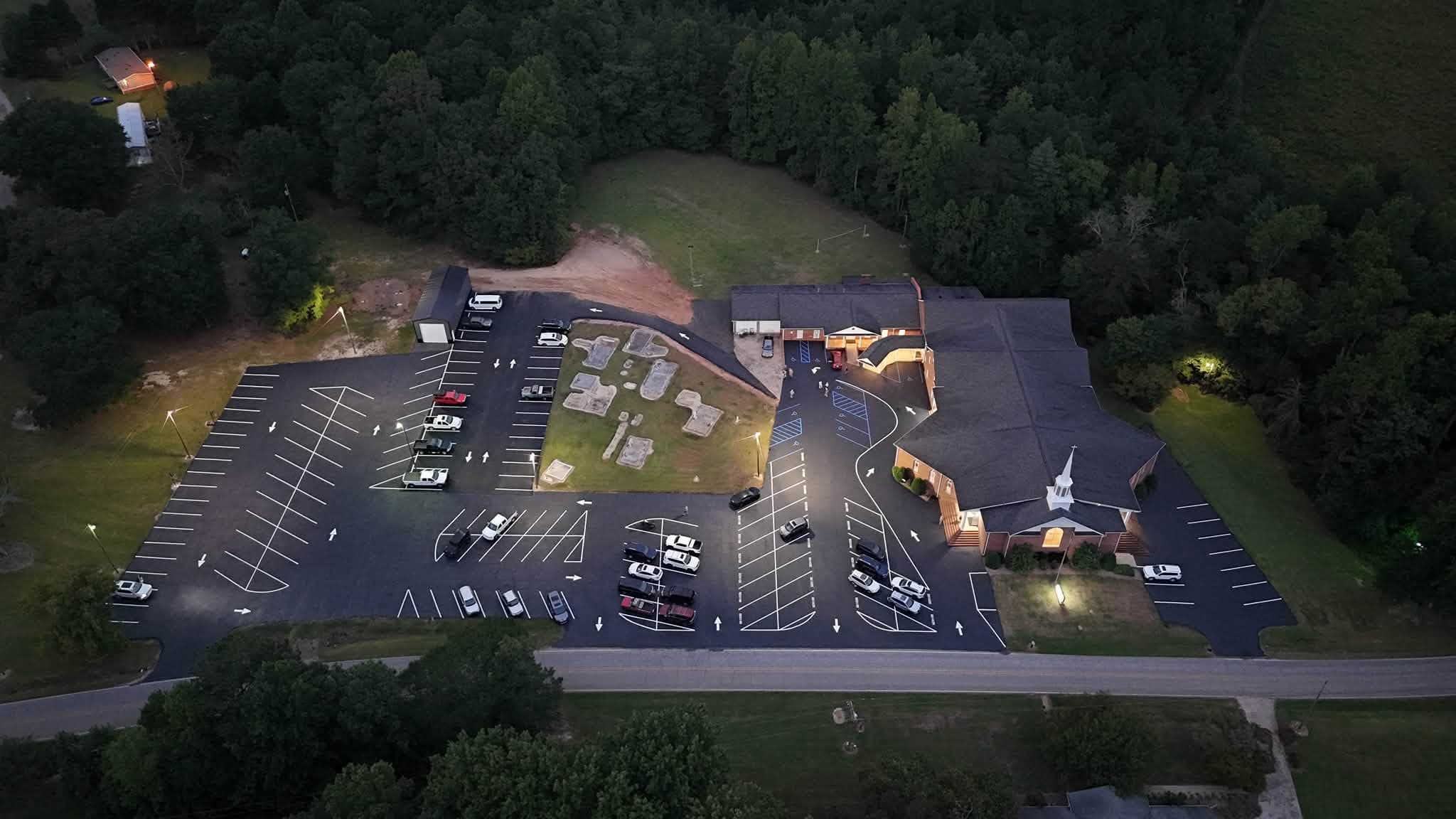 Aerial view of a paved church parking lot