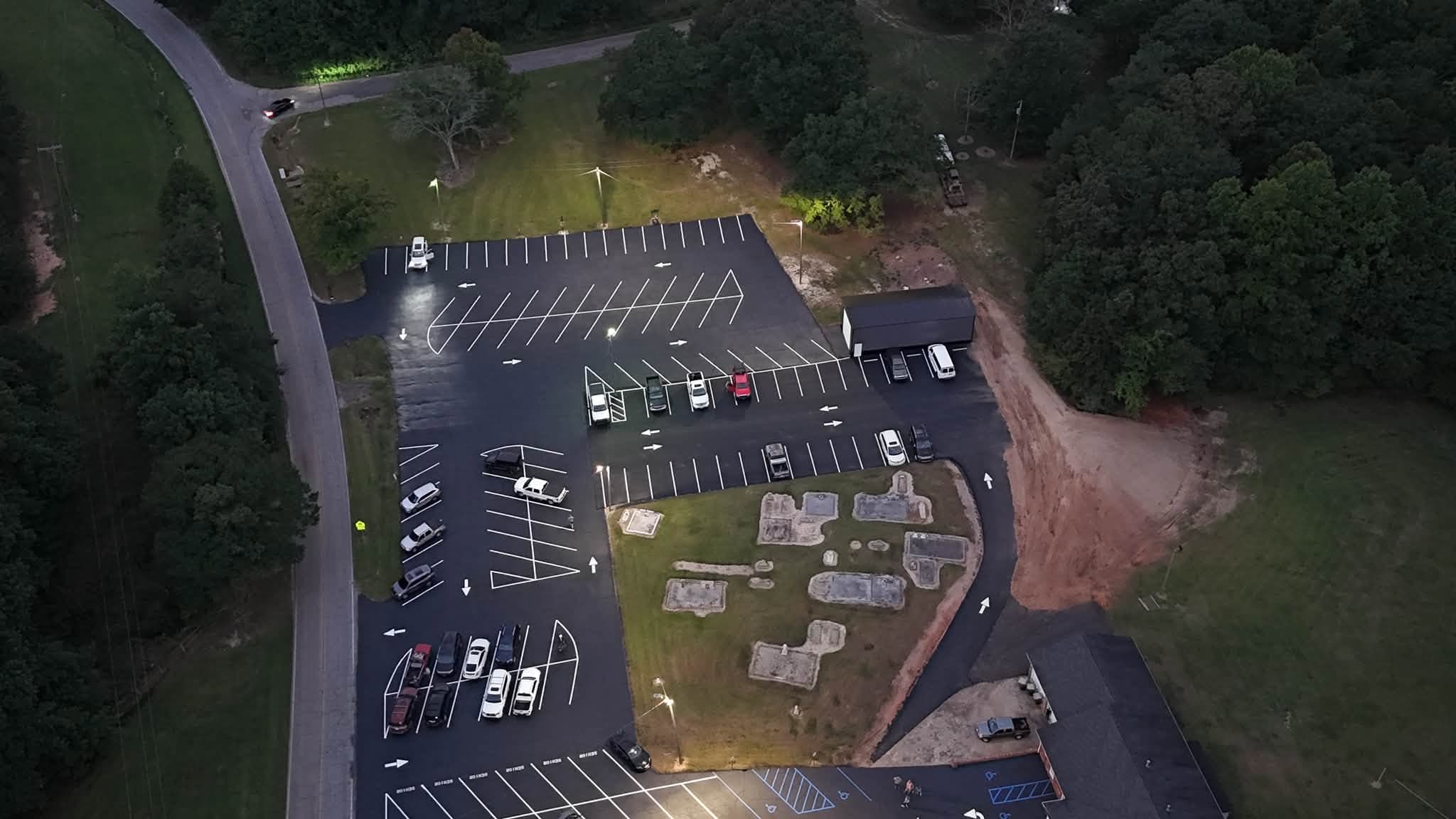 Overhead view of a paved and marked parking lot