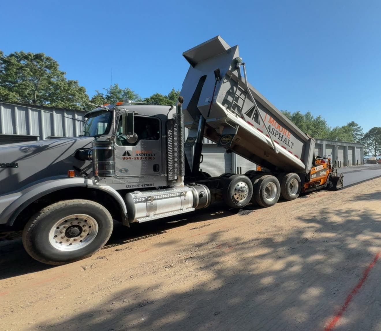 Paving crew working behind the paver