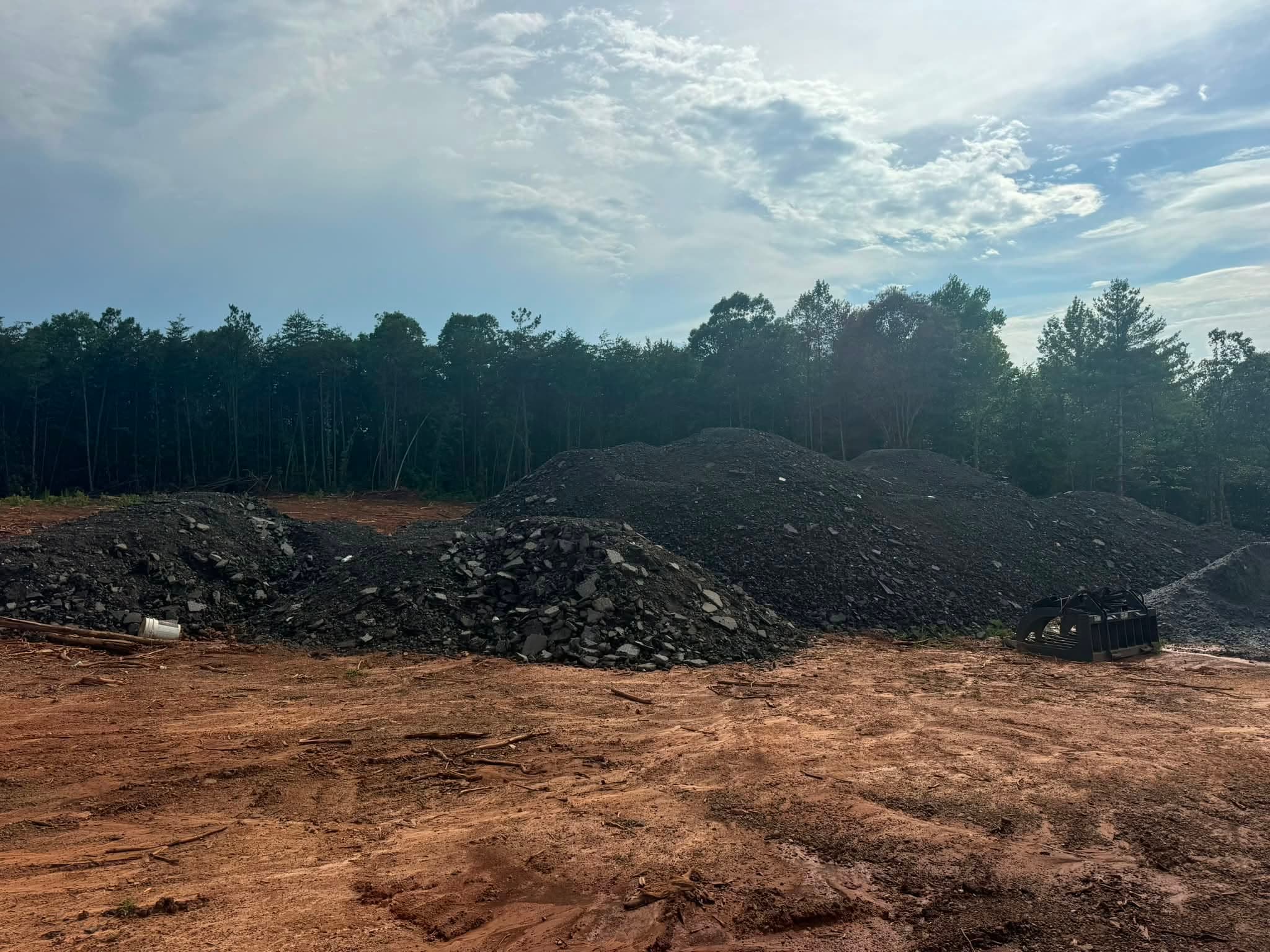 Base material and red clay on a cleared job site